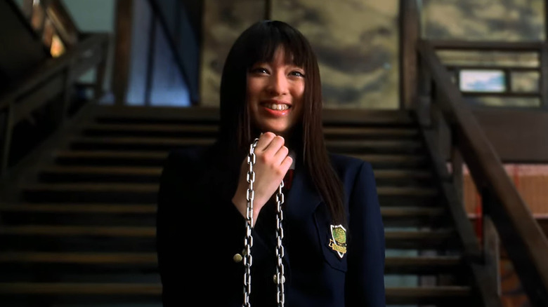 Gogo smiles with chain