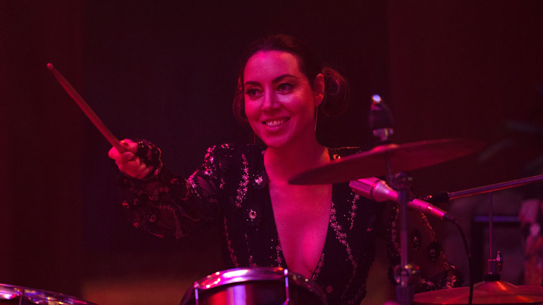 Rio Vidal smiling playing drums