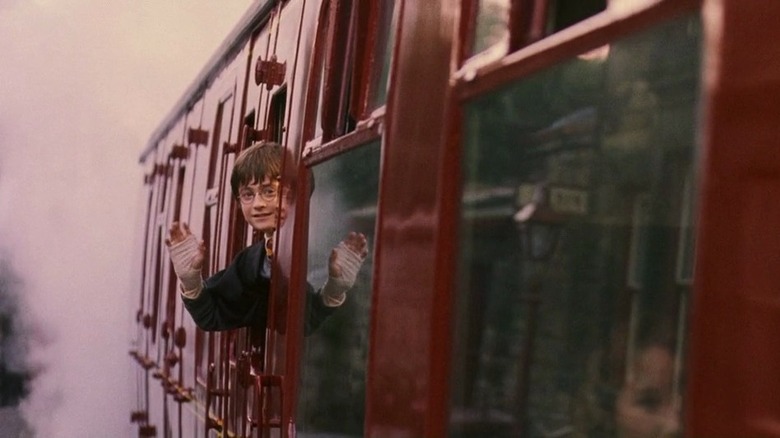 Harry waves from the train