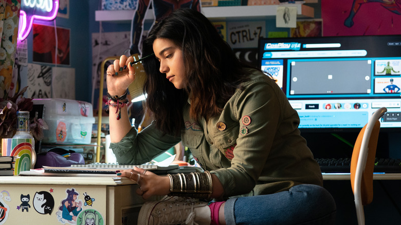 Kamala Kahn working at desk