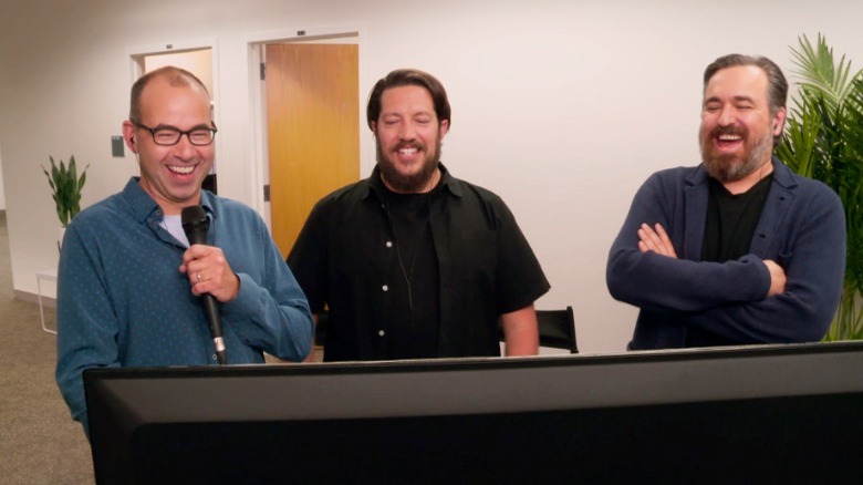 Murr, Q, and Sal looking at a monitor