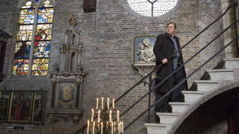 Brendan Gleeson in a church 