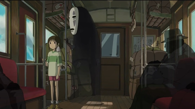 No-Face and Chihiro on the train