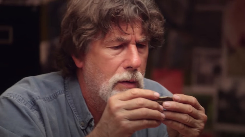 Rick Lagina examining human bone