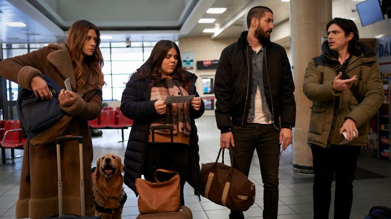 Murphy, Jess, Max, Felix, and Pretzel talking at airport