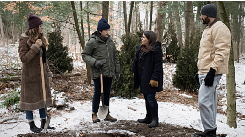 Murphy, Felix, Jess, and Max burying a body