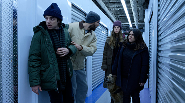 Murphy, Jess, Max, and Felix at a storage building