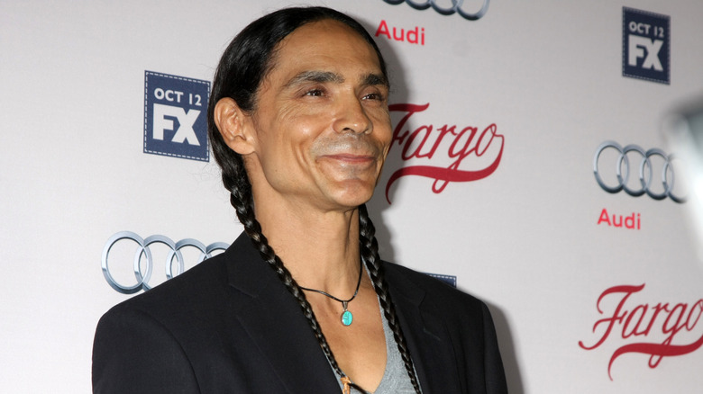 Zahn McClarnon smiles