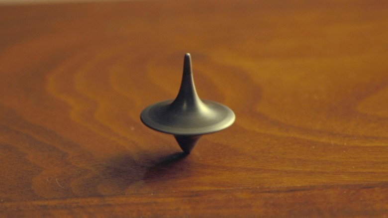 Spinning top on wood table