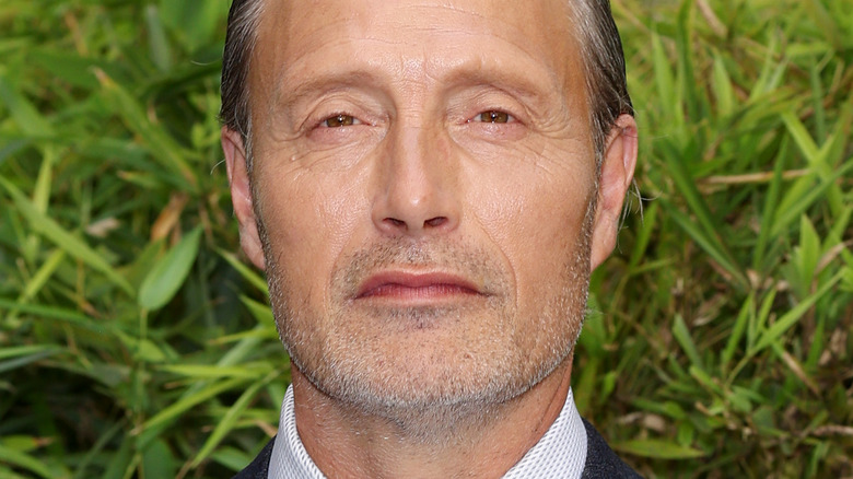 Mads Mikkelsen smirking