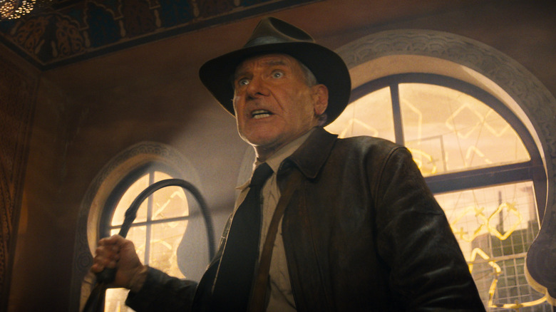 Indiana Jones holds whip