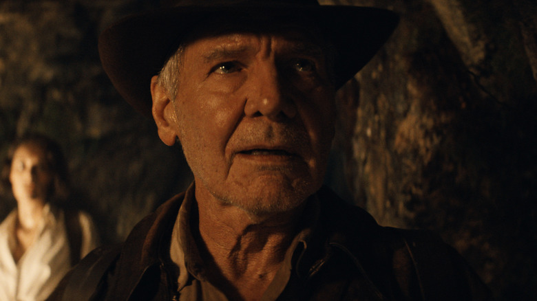 Indiana Jones looking amazed in a cave