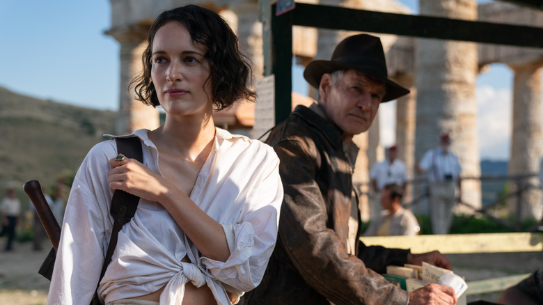 Helena and Indiana standing by a car