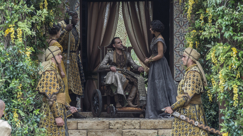 Ellaria Sand in Dorne standing next to her sitting brother-in-law