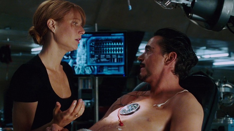 Pepper Potts changing Tony Stark's Arc Reactor