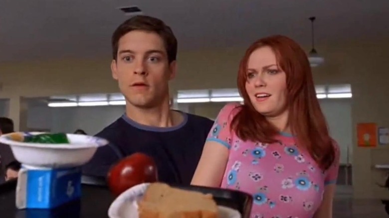 Peter Parker catches food in cafeteria with Mary Jane