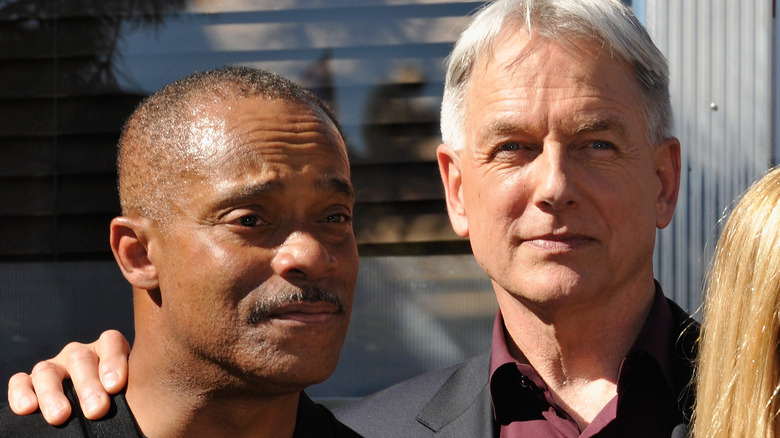 Rocky Carroll, Mark Harmon pose for group photo