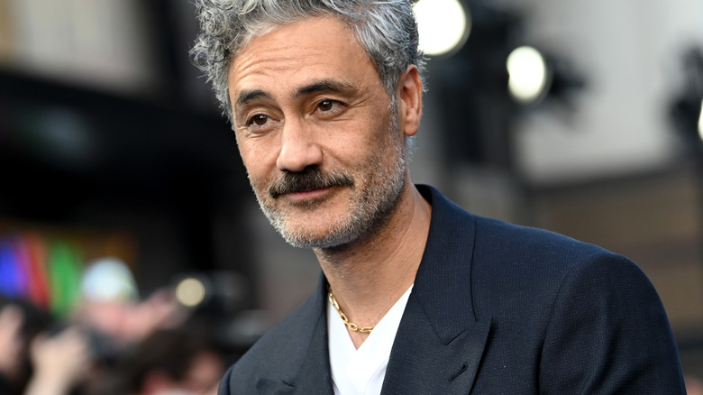 Taika Waititi wearing a black blazer