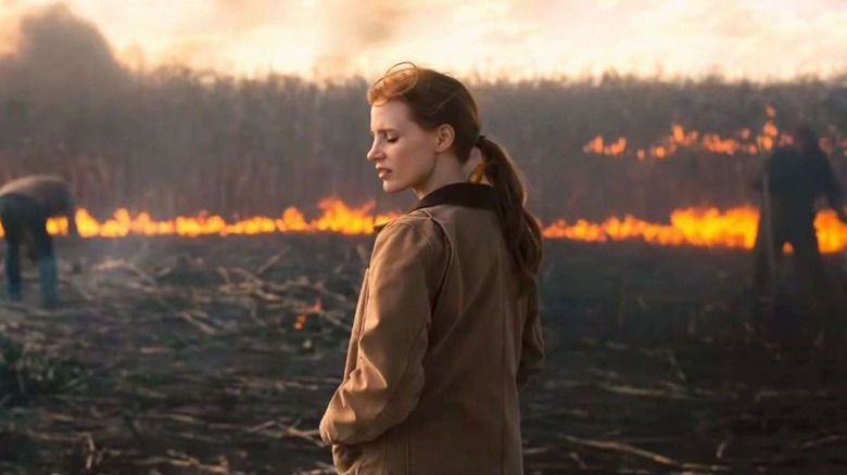 jessica chastain in burning field looking down