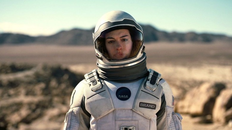 Anne Hathaway wearing NASA suit