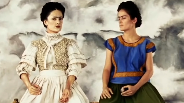 Salma Hayek stands as Frida Kahlo