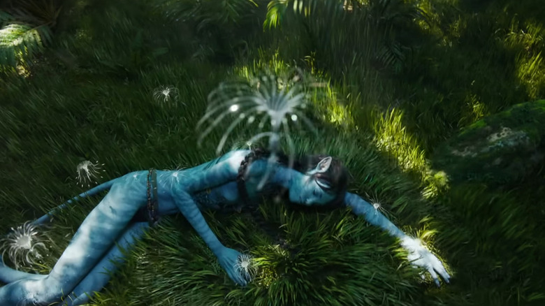 Kiri sleeping in the grass in Avatar: The Way of Water