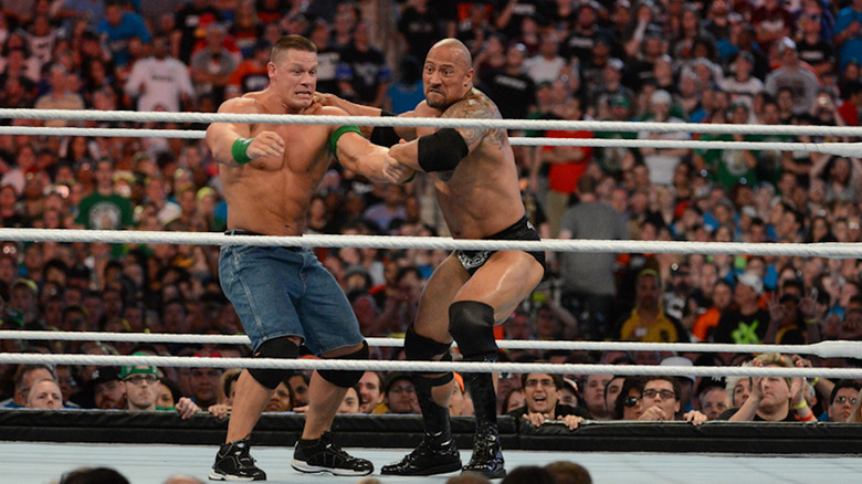 Dwayne ''The Rock'' Johnson and John Cena in action during WrestleMania XXVIII at Sun Life Stadium on April 1, 2012 in Miami Gardens, Florida