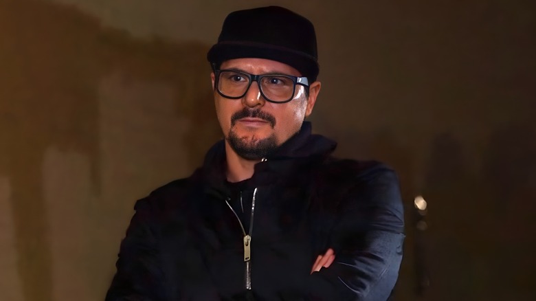 Zak Bagans looking serious arms folded