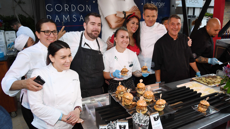 Gordon Ramsay and chefs smiling