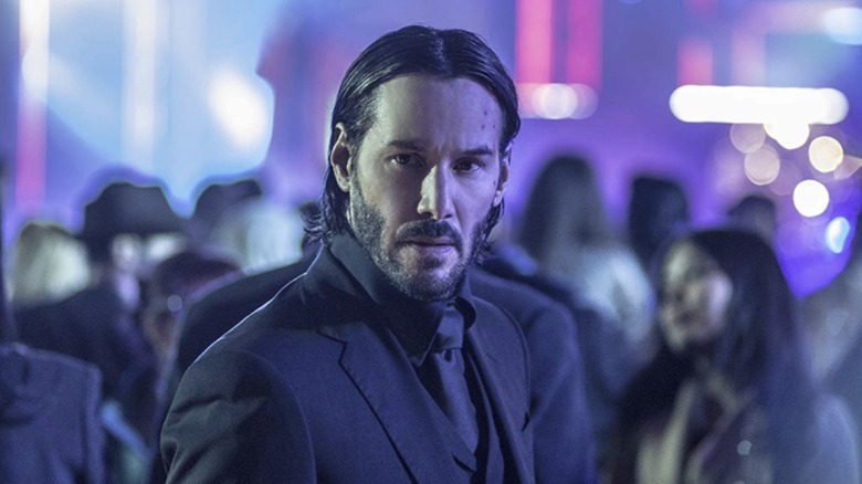 John Wick frowning in Berlin club