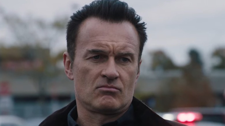 Julian McMahon steely faced