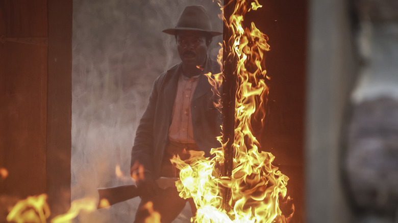 Bass Reeves in fiery doorway