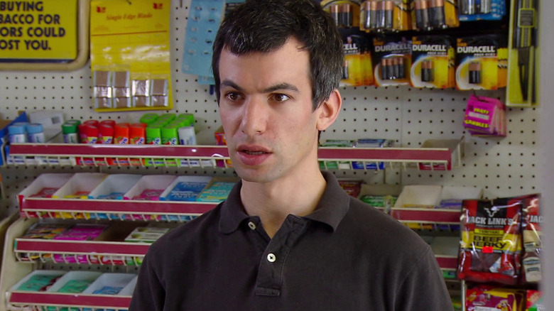 Nathan Fielder standing in a store