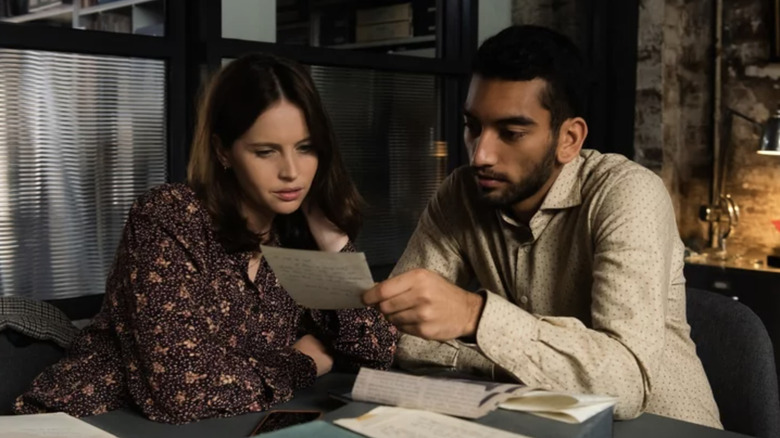 Ellie and Rory looking at a letter