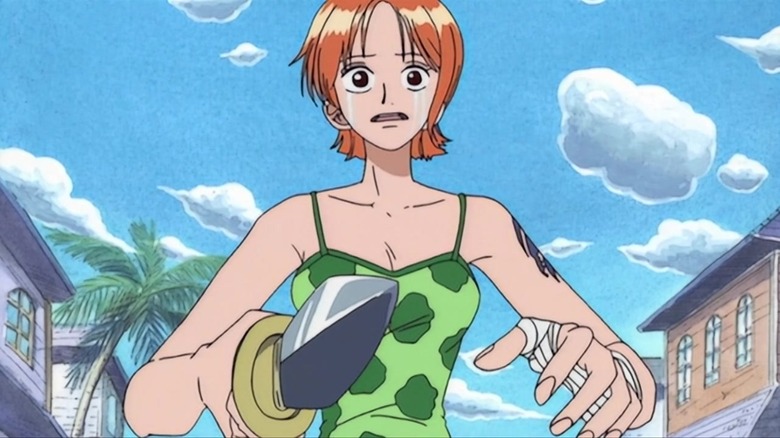 Nami crying and pointing a knife