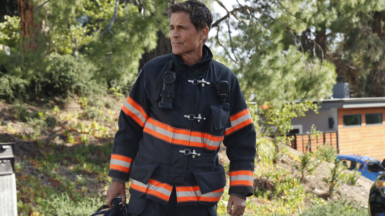 Owen Strand wears firefighter jacket