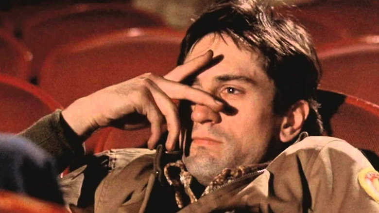 Travis Bickle covering his eyes