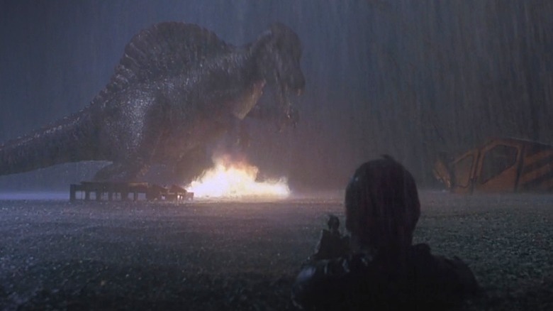 Alan Grant firing a flare at the Spinosaurus