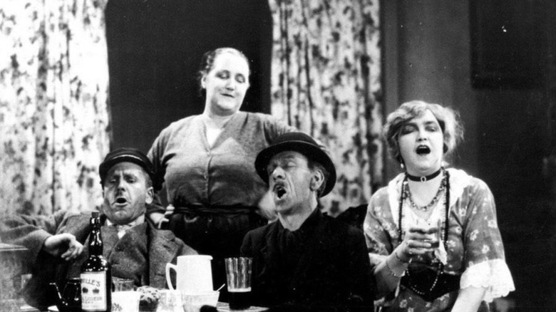 Cast of Juno and the Paycock drinking, laughing