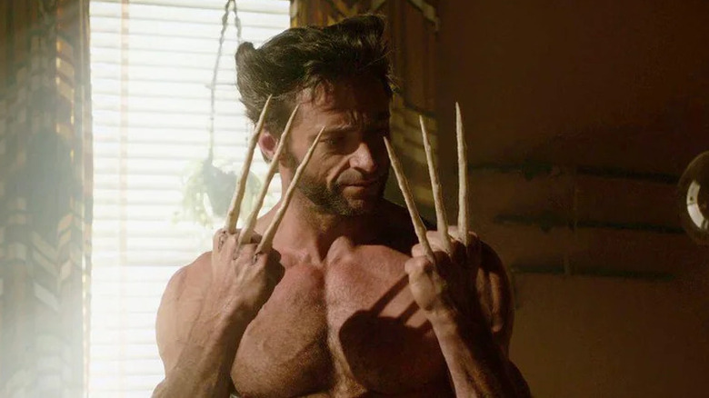 Logan looking at his bone claws in "X-Men Origins: Wolverine" (2009)