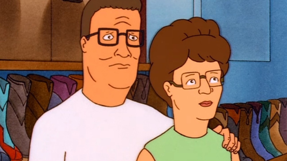 Hank and Peggy Hill standing next to each other