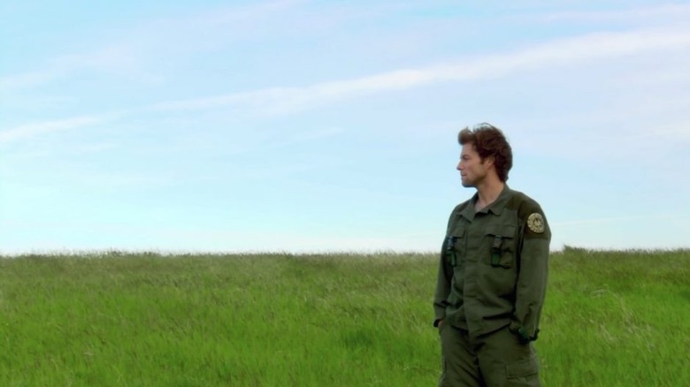 Battlestar Galactica pilot looks into distance