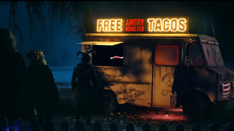 Teenagers approaching haunted taco truck