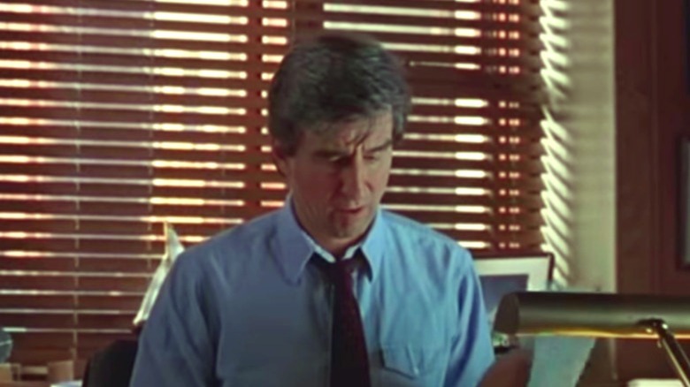 Jack McCoy working at desk