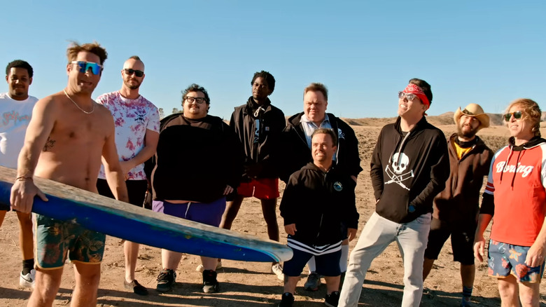 The Jackass cast standing on a beach