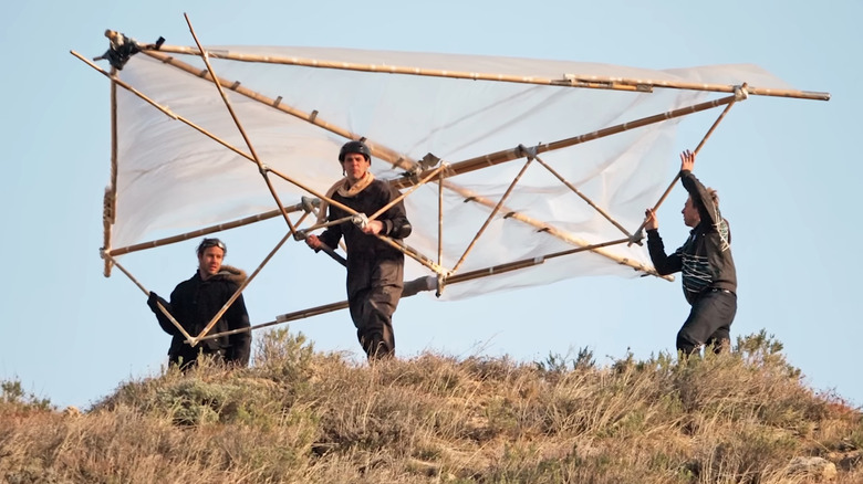 Steve-O holds hang glider