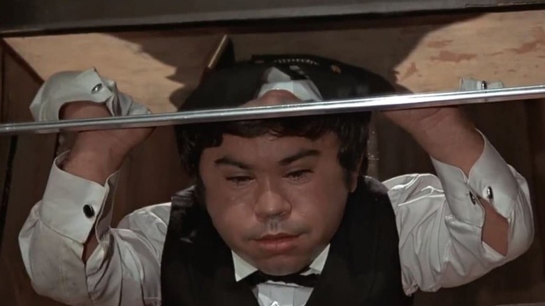 Hervé Villechaize looks down