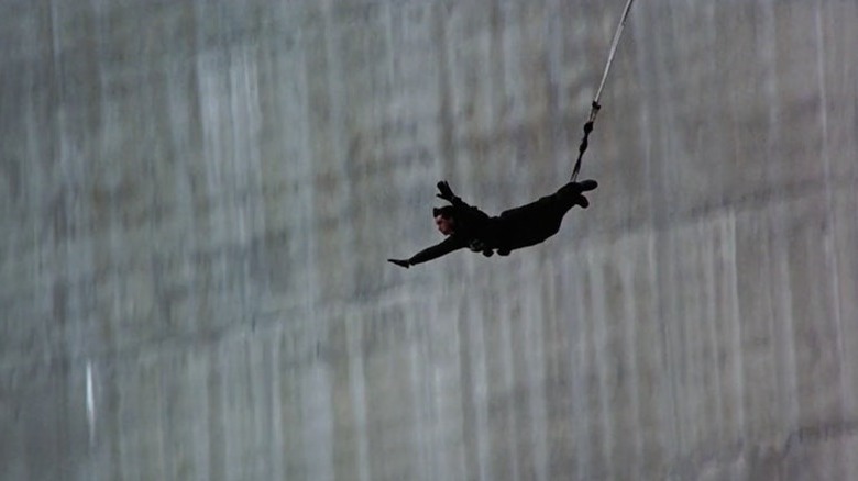 Bond bungee-jumps off a dam