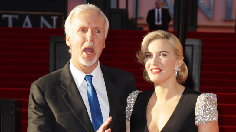 James Cameron and Kate Winslet look away from camera