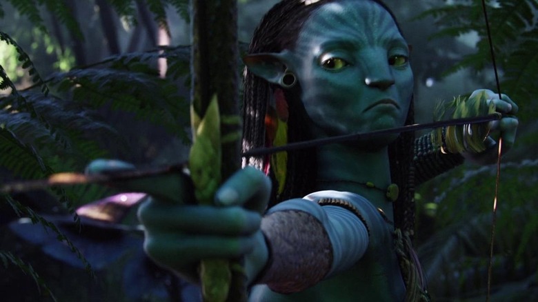 Zoe Saldana with weapon in Avatar
